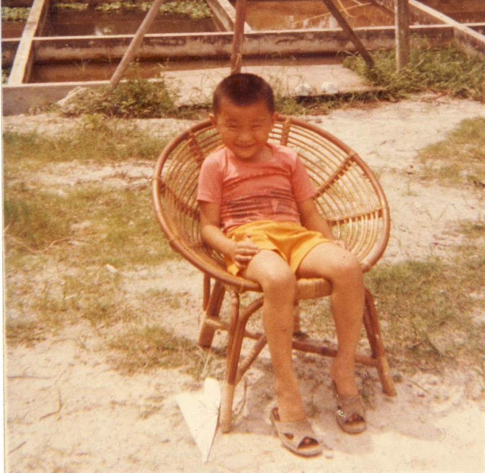 Tan had a happy childhood growing up in a kampung. He is six in this photo.