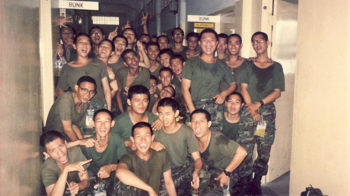 Tan (standing, third from right) during National Service days. After NS, he returned to his old drug habit.